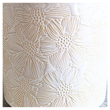 Load image into Gallery viewer, Otis White ceramic planter with floral patterns on a gray surface, featuring the LEAFERIE brand.