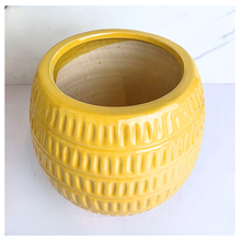 Load image into Gallery viewer, Daisy Yellow textured ceramic pot with 'LEAFERIE' branding on a marble background