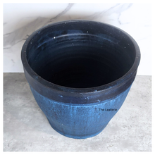 Load image into Gallery viewer, Black ceramic pot on a light gray surface with a white marble background