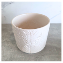 Load image into Gallery viewer, Ovelle Two white ceramic planters with leaf pattern on a marble surface, featuring the brand 'LEAFERIE'.
