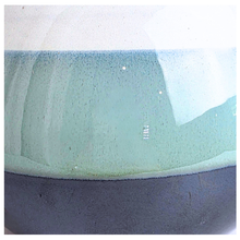 Load image into Gallery viewer, Close-up of a ceramic bowl or vase showing a two-tone glaze design with a light mint green upper section and a dark charcoal gray lower section.