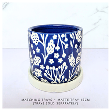 Load image into Gallery viewer, Marina Blue ceramic pot with white floral patterns on a white background, featuring the brand 'LEAFERIE'.