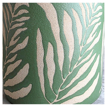 Load image into Gallery viewer, Lierre Green container with leaf pattern on a light gray surface, featuring the brand 'LEAFERIE'.