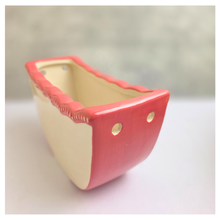 Load image into Gallery viewer, Ivra hangiing Ceramic planter with red rim and white interior on a light gray background, featuring the brand 'LEAFERIE'.