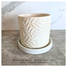 Load image into Gallery viewer, Silas White ceramic planter with leaf pattern on a gray surface, branded 'LEAFERIE'.
