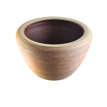 Load image into Gallery viewer, A small ceramic planter pot with a textured, ribbed exterior in a warm tan-brown glaze and a contrasting dark brown interior, shown on a plain white background.