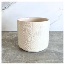 Load image into Gallery viewer, Ovelle Two white ceramic planters with leaf pattern on a marble surface, featuring the brand 'LEAFERIE'.