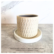 Load image into Gallery viewer, Hugo Ceramic planter with textured design on a gray surface, featuring the brand 'LEAFERIE'.