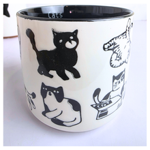 Load image into Gallery viewer, Two mugs with cat designs on a white surface, featuring the Leaferie and Olivier Seven logos.