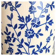 Load image into Gallery viewer, Caelis Ceramic planter with blue floral pattern on a marble surface, featuring the brand 'LEAFAERIE'.
