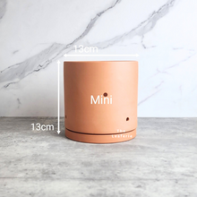 Load image into Gallery viewer, The Leaferie terracotta E Pot with holes. comes in 2 sizes. Mini size