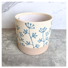 Load image into Gallery viewer, Evie floralCylindrical fabric basket with blue floral patterns on a light background, featuring the brand 'LEAFERIE'.