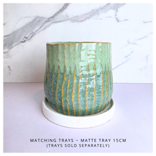 Load image into Gallery viewer, Pistachio Leaferie Green ceramic planter with gold accents on a white background, featuring the Leaferie brand