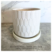 Load image into Gallery viewer, Finn White ceramic planter with geometric pattern on a marble surface, featuring the Leaferie brand.