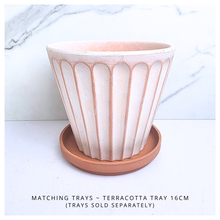 Load image into Gallery viewer, Yuno terracotta planter with ribbed design on a marble background, featuring the brand 'LEAFERIE'.