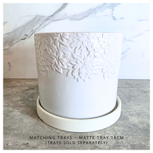 Load image into Gallery viewer, Mason White ceramic planter with floral patterns on a marble surface, featuring the Leaferie brand.