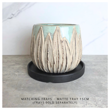 Load image into Gallery viewer, Rowan ceramic planters with textured design on a gray surface, branded 'LEAFERIE'.