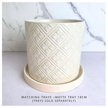 Load image into Gallery viewer, Elaris White textured ceramic planter on a marble background with 'LEAFAERIE' branding.