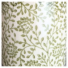 Load image into Gallery viewer, Selora Decorative planter with green floral pattern on a gray surface, featuring the brand 'LEAFERIE'.