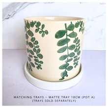 Load image into Gallery viewer, Verdin Two ceramic planters with green leaf patterns on a light blue background, featuring the brand 'LEAFERIE'.