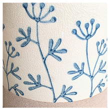 Load image into Gallery viewer, Evie floralCylindrical fabric basket with blue floral patterns on a light background, featuring the brand 'LEAFERIE'.