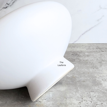 Load image into Gallery viewer, Xara ceramic flowerpot in white, black, and green with Leaferie branding.