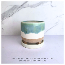 Load image into Gallery viewer, Lumea Ceramic planter with green and beige gradient on a marble background, featuring the brand 'LEAFERIE'.
