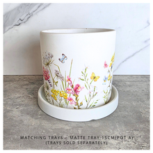 Load image into Gallery viewer, The Leaferie Rhea Two ceramic planters with floral designs on a marble surface, featuring the brand 'LEAFERIE'.