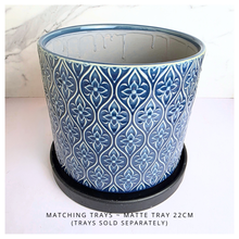Load image into Gallery viewer, Sapphire Blue patterned candle container with 'LEAFAERIE' branding on a marble background