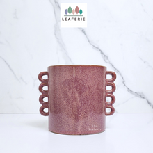 Load image into Gallery viewer, The Leaferie Juro red planter with many handles. ceramic material front view of pot