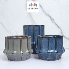 Load image into Gallery viewer, The Leaferie Lilo planter. blue and green colour. ceramic material . 3 designs. Front view