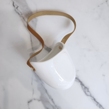 Load image into Gallery viewer, The Leaferie PAtina hanging planter. material ceramic.white colour with leather strap. no drainage hole. front view