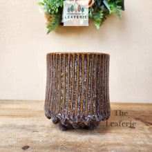 Load image into Gallery viewer, The Leaferie Ide pot. purple ceramic pot with studs at the bottom.