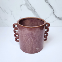 Load image into Gallery viewer, The Leaferie Juro red planter with many handles. ceramic material front view of pot
