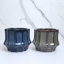 Load image into Gallery viewer, The Leaferie Lilo planter. blue and green colour. ceramic material . 3 designs. Front view of design A and B