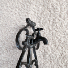 Load image into Gallery viewer, The Leaferie cast iron water hose holder. front view close up of hose