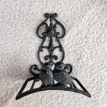 Load image into Gallery viewer, The Leaferie cast iron water hose holder. front view