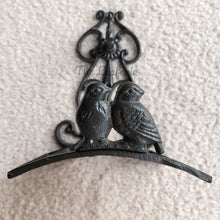 Load image into Gallery viewer, The Leaferie cast iron water hose holder. front view