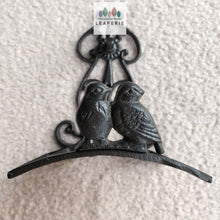 Load image into Gallery viewer, The Leaferie cast iron water hose holder. front view