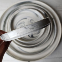 Load image into Gallery viewer, The Leaferie Marbled like round ceramic trays. 6 designs. white marble . side view