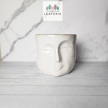 Load image into Gallery viewer, The Leaferie Faustine face white ceramic pot. front view