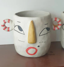 Load image into Gallery viewer, The Leaferie Faccia handmade pot. ceramic face pot. front view of stripey ear