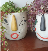 Load image into Gallery viewer, The Leaferie Faccia handmade pot. ceramic face pot. front view of yellow ear