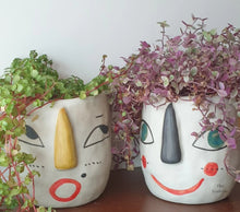 Load image into Gallery viewer, The Leaferie Faccia handmade pot. ceramic face pot. front view of yellow ear and stripey ear