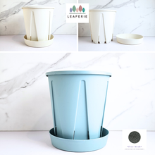 Load image into Gallery viewer, Light blue plastic planter with a matching saucer , featuring the LEAFERIE brand.

