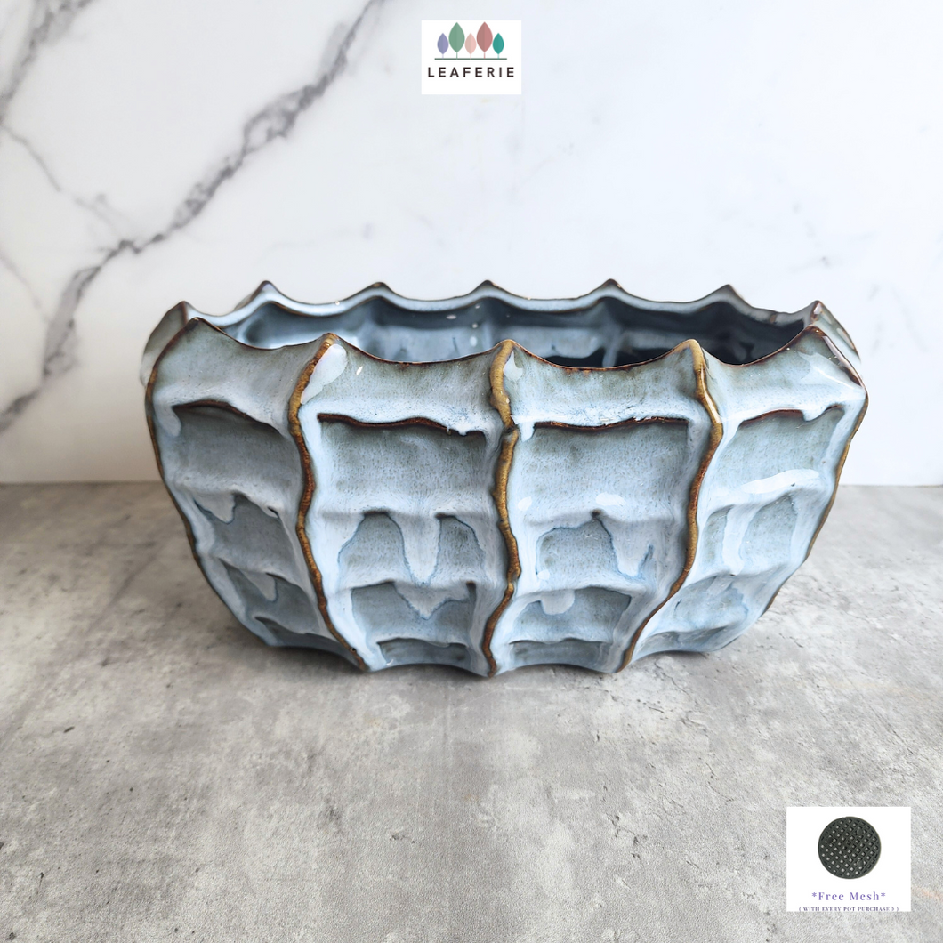 The Leaferie Eve Shallow flowerpot. ceramic blue pot