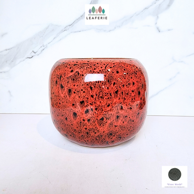 The Leaferie Mirage red flowerpot. ceramic material