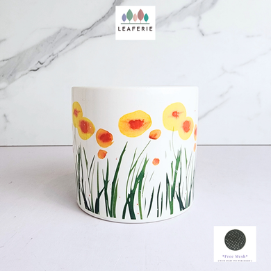 Planter with floral design on a white background, featuring the Leaferie brand.