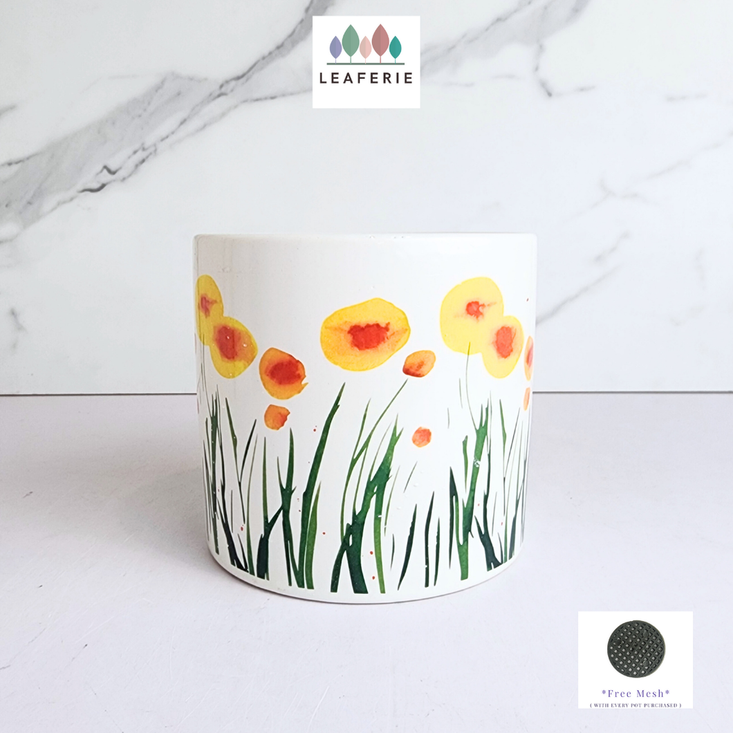 Planter with floral design on a white background, featuring the Leaferie brand.
