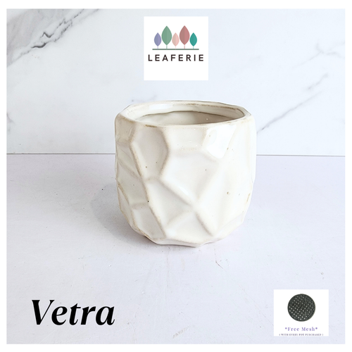 White textured planter with 'LEAFERIE' branding on a light gray background